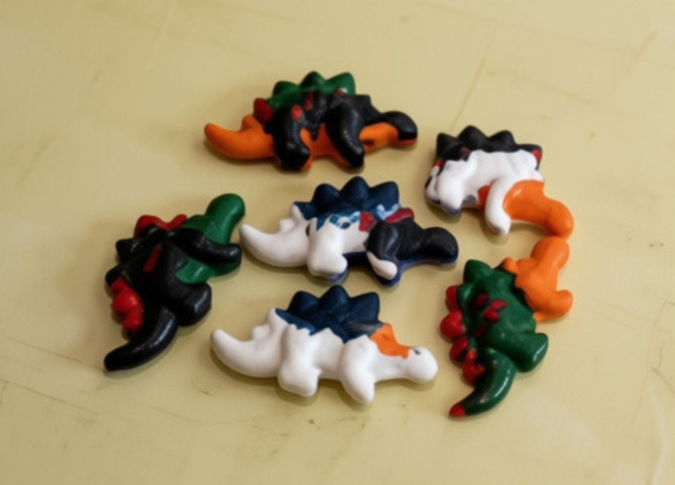 Stegosaurus shaped crayons in assorted colours